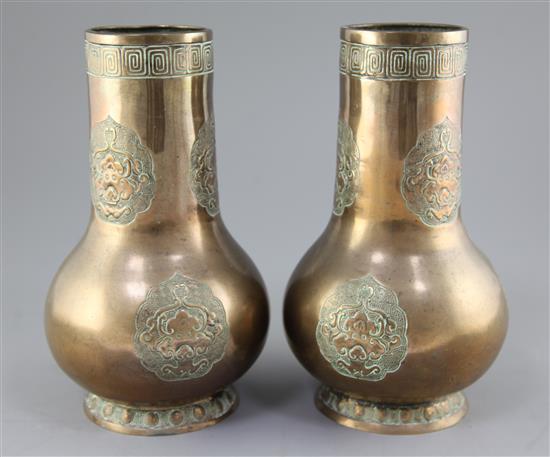 A pair of Chinese bronze archaistic bottle vases, 18th / 19th century, height 26.5cm